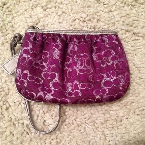 Purple and silver coach wristlet